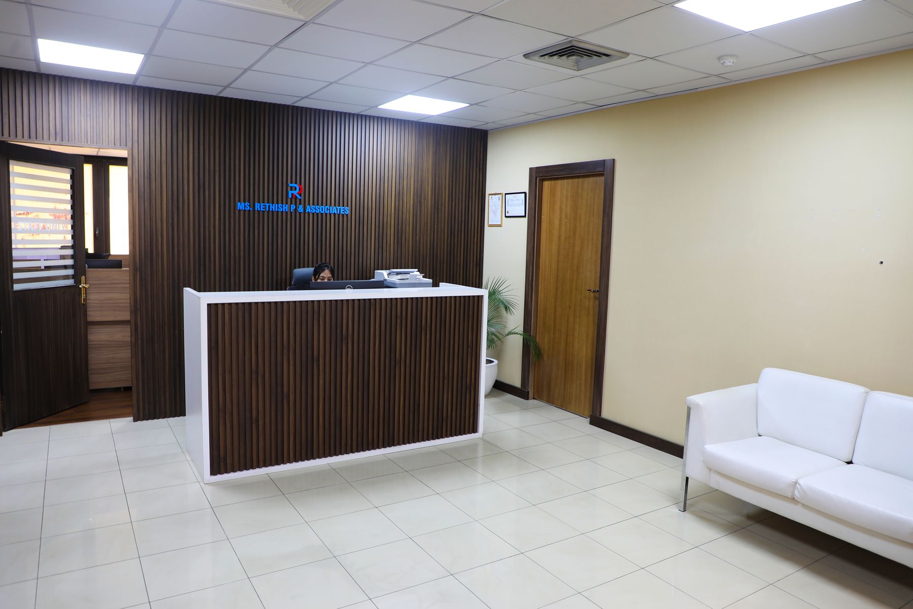 Reception area with desk and waiting sofa