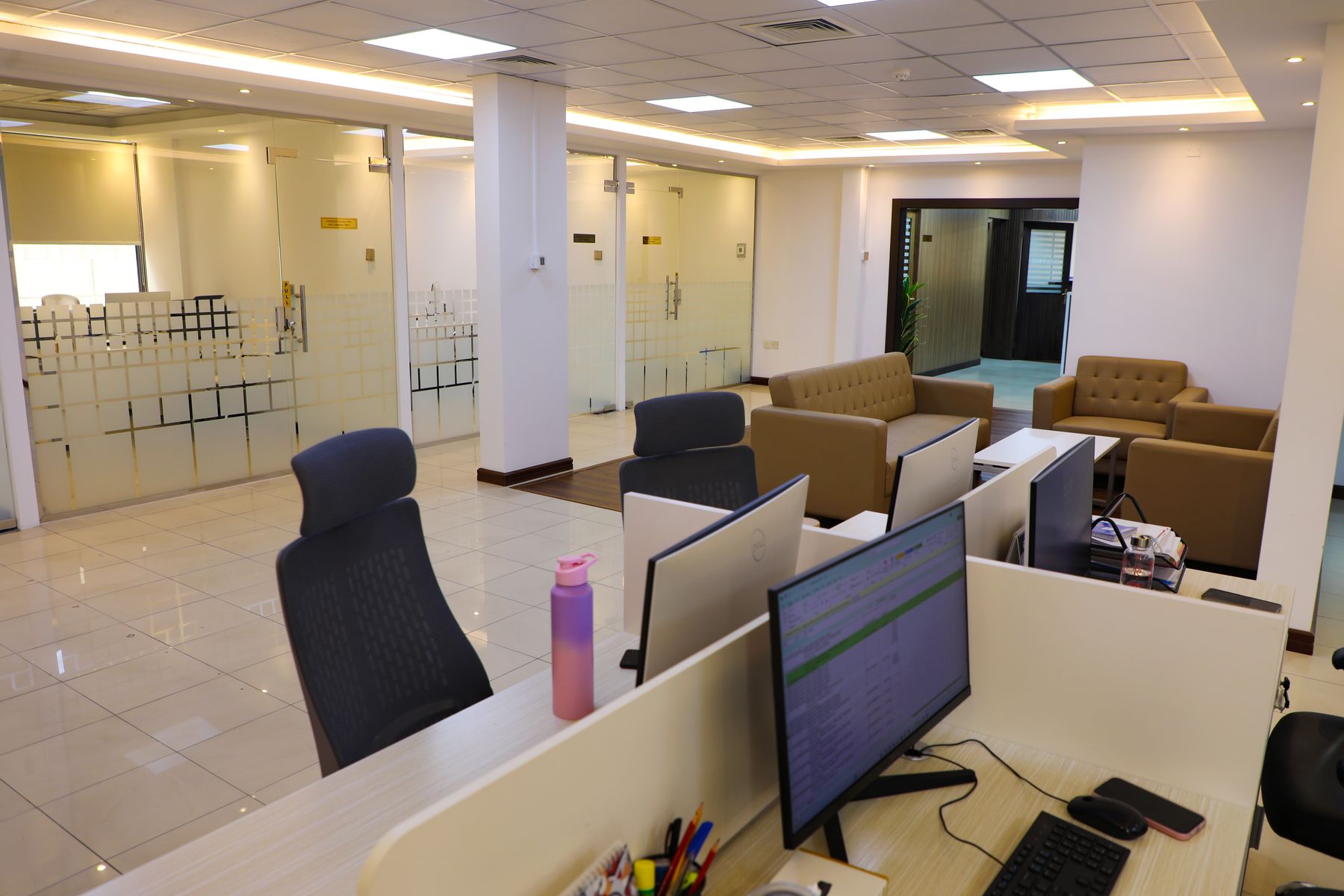 Glass-partitioned office workstations